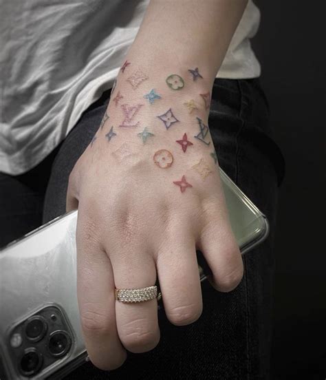 louis vuitton hand tattoos.